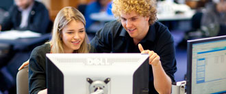 two undergraduates using a computer